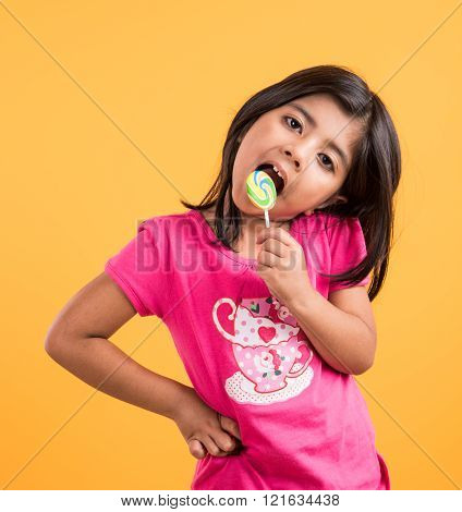 indian small girl with lollipop or loly pop, asian girl and lollipop or lolypop