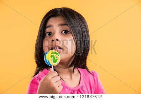 indian small girl with lollipop or loly pop, asian girl and lollipop or lolypop