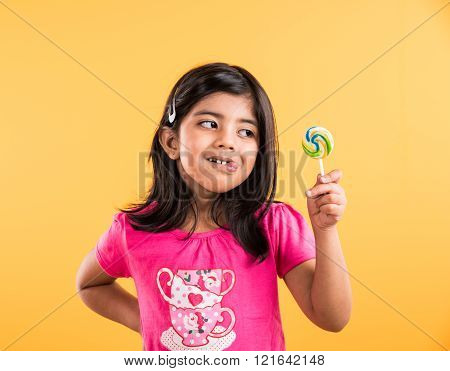 indian small girl with lollipop or loly pop, asian girl and lollipop or lolypop