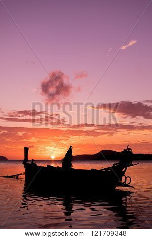 Long tail fishing boats at sunet in Thailand