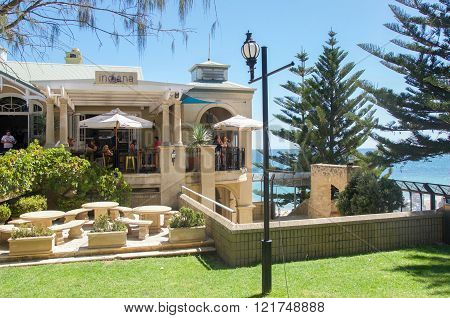 COTTESLOE,WA,AUSTRALIA-MARCH 13,2016: The Indiana Tea House outdoor cafe seating with people at Cottesloe Beach in Cottesloe, Western Australia.