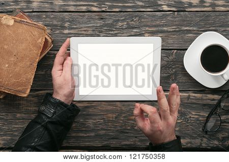 Men communicate using tablet computer through the Internet in cafe