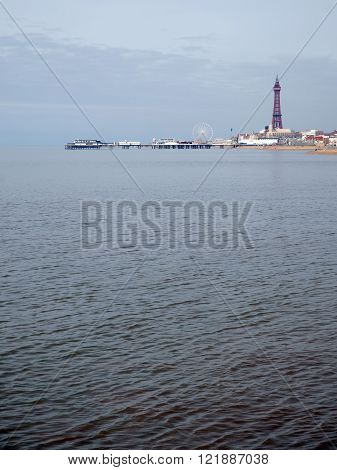 Blackpool tower and North Pier at high tide