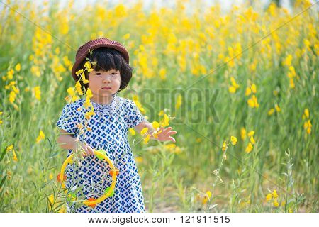 Cute Asian girl wearing white dress in yellow sunhemp flower field
** Note: Soft Focus at 100%, best at smaller sizes