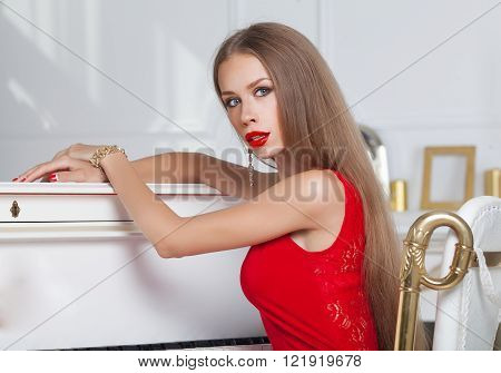 Sexy stylish blonde beautiful woman in red dress