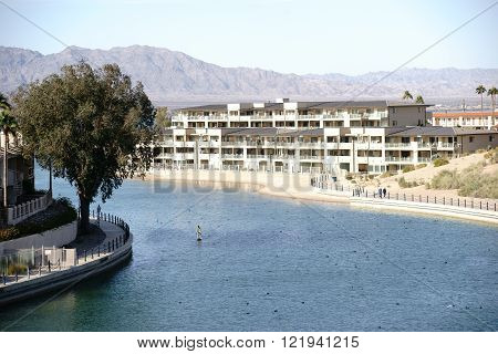 The harbor entrance to Lake Havasu City with houses and apartment buildings on Lake Havasu.
