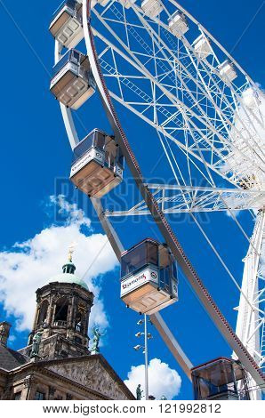 AMSTERDAM NETHERLANDS-APRIL 30: Ferris wheel on Dam Square on April 30 2015 in Amsterdam.