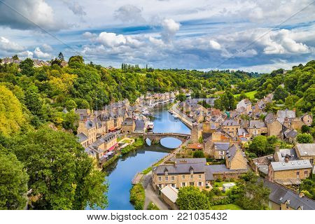 Aerial view of the historic town of Dinan with Rance river with dramatic cloudscape, Cotes-d'Armor department, Bretagne, northwestern France