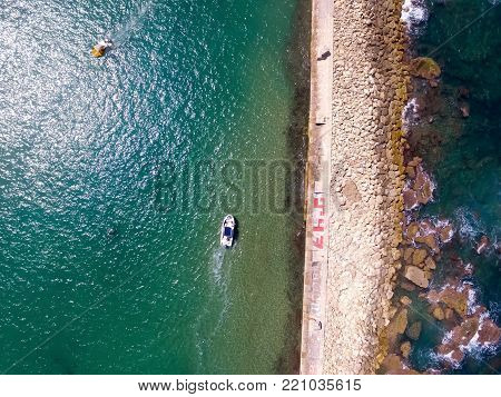drone view of two boats sailing in different directions