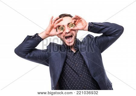 Crazy Ecxited Young Sucessful Man Cover Eyes With Golden Bitcoins Isolated On White Background
