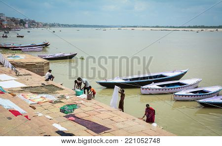 Drying Clothes On The Riverbank