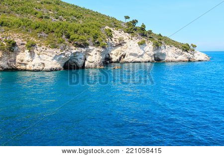 Summer rocky sea coast Baia Di Campi Vieste on the Gargano peninsula, Puglia, Italy