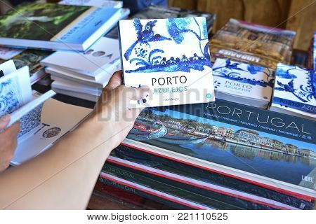 PORTO, PORTUGAL - AUGUST 10, 2017 : Bookshelf in a book shop Livraria Lello with the books about a city Porto