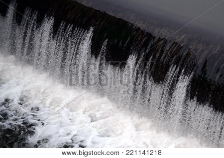 A Picture Of The Flowing Water. The Dam Is Designed To Regulate The Water Level In Rivers Within The