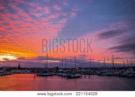 yachts and ships in marina at sunset, ahuriri, napier, new zealand