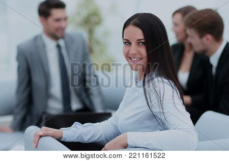 Portrait of businesswoman  looking at camera on the background o