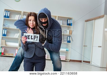 Criminal taking businesswoman as hostage in office