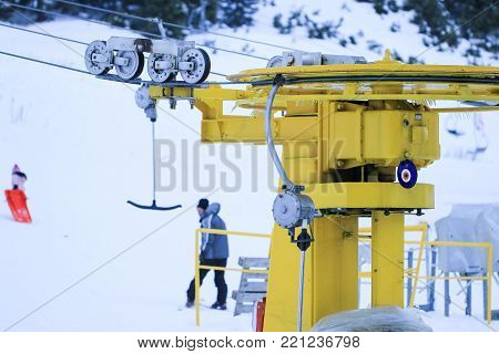 Mechanism of transportation cable lift on the snow mountain. Uludag the ancient Mysian Olympus and Bithynian Olympus, is a mountain in Bursa Province, Turkey. Ski lifts durings bright winter day.
