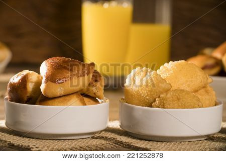 Mixed brazilian snack on wood background. Salgadinhos.