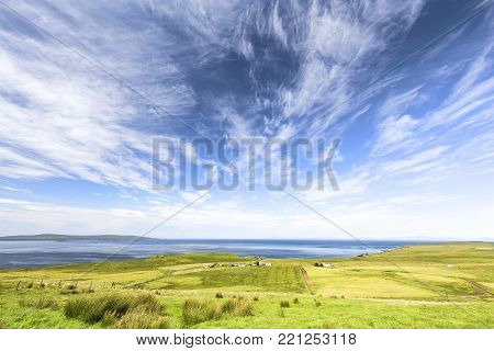 Blue Sky Over Fields And Ocean In Linicro On The Isle Of Skye, Scotland.
