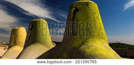 Colorful pylons standing at Silvalde's beach in a warm morning
