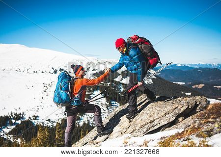 Two Climbers Are In The Mountains.