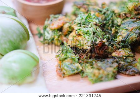 Acacia Pennata Omelette On Wooden Plate. (selective Focus Acacia Pennata Omelette )