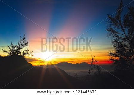 Early morning after sunrise view of the spectacular Gunung Bromo and Sumeru volcanoes in Java, Indonesia