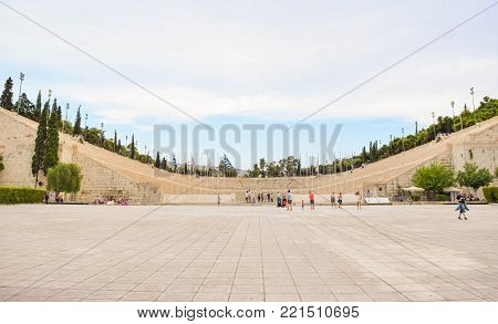 Athens, Greece - July 16, 2017: Tourists nea the unique marble Panathenaic Stadium in Athens.
