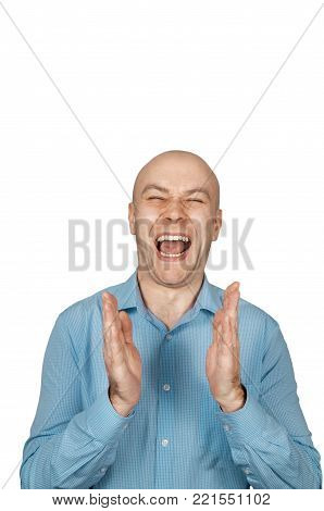 White bald man in a blue shirt clapping on a white background and laughs, isolated.