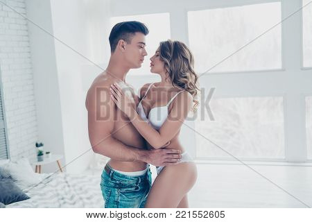 Side View Profile Of Stunning, Young Macho With Naked Torso In Jeans Embracing With Sexy Woman With