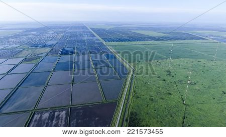 Masts longwave antennas communication among the rice fields flooded. Telecommunications and communications equipment and radar.