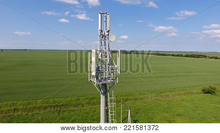 Cellular tower. Equipment for relaying cellular and mobile signal. Fly around up and down.