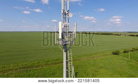 Cellular tower. Equipment for relaying cellular and mobile signal. Fly around up and down.