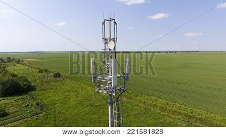 Cellular tower. Equipment for relaying cellular and mobile signal. Fly around up and down.