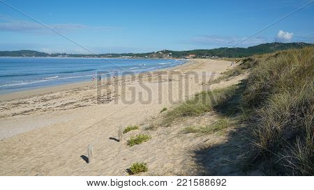 O GROVE, SPAIN - SEPTEMBER 16, 2017: Beautiful beach Playa de A Lanzada close to O Grove, coast of Galicia on September 16, 2017 in Spain