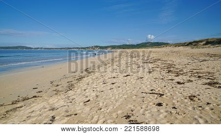 O GROVE, SPAIN - SEPTEMBER 16, 2017: Beautiful beach Playa de A Lanzada close to O Grove, coast of Galicia on September 16, 2017 in Spain