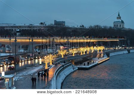Moscow, Russia - January 5, 2018: Poryachiy bridge in Zaryadye Park in the evening with New Year's and Christmas lights in Moscow in Russia.