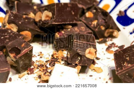 typical italian christmas Torrone (turron) with chocolate and gianduja hazelnuts