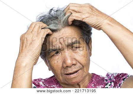 Old woman felt a lot of anxiety about hair loss issue on white background, scalp problem concept