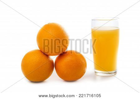 portrait of fresh sunkist orange with a glass of orange juice isolated on white background