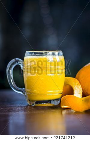 Close Up Of Orange,citrus Aurantium Juice On Wooden Surface.