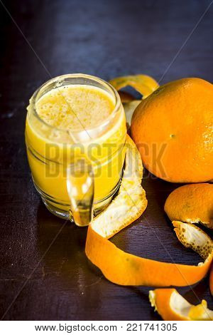 Close Up Of Orange,citrus Aurantium Juice On Wooden Surface.