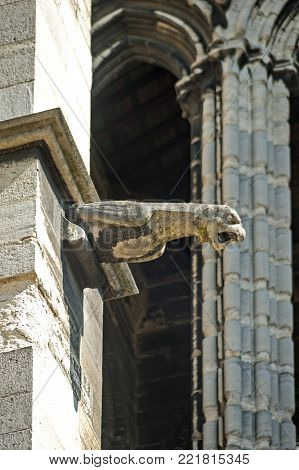 Gargoyle on the wall of the Basilica of Saint Denis, the final resting place of the kings and queens of France.
