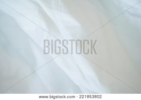 Top view of a messy bedding sheet after night sleep.