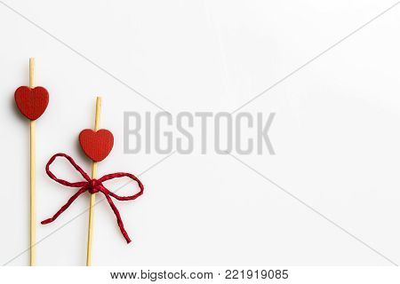 Three handmade heart cupcake toppers on white background Horizontal