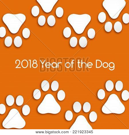 Dog footprints cut paper with soft shadow. Year of the dog.