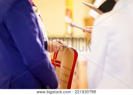 Prist Blessing Wedding Rings In Church