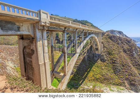 Prospective view of iconic Bixby Bridge on Pacific Coast Highway Number 1 in California, United States.Bixby Bridge is located near Pfeiffer Canyon Bridge collapsed in Big Sur. American travel concept