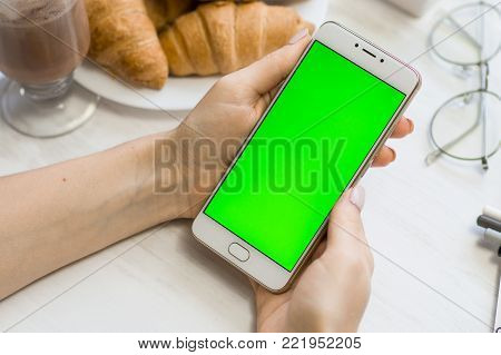 Beautiful Girl Holding A Smartphone In The Hands Of A Green Screen Green Screen, Hand Of Man Holding